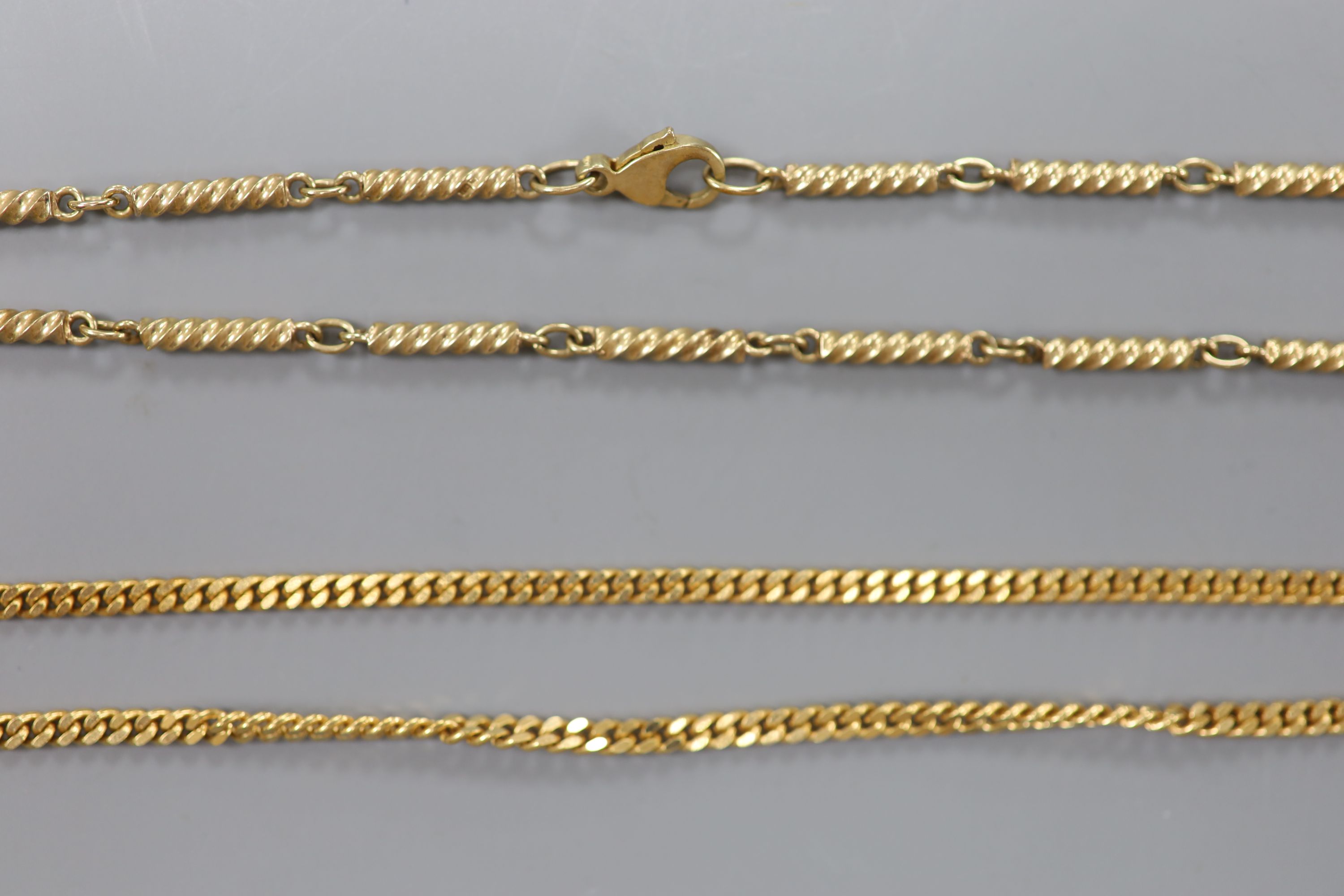 A modern 9ct gold curb link chain and one other 9ct spiral baton link chain, 39cm